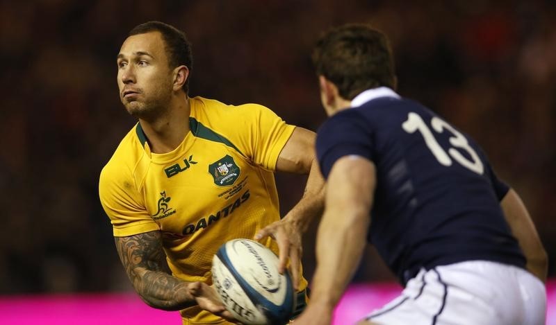 © Reuters. Australia's Quade Cooper is challenged by Scotland's Nick De Luca during their rugby union international test match at Murrayfield Stadium in Edinburgh