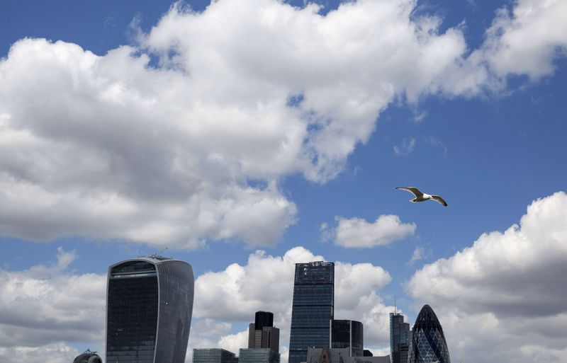© Reuters. A bird flies past the London skyline