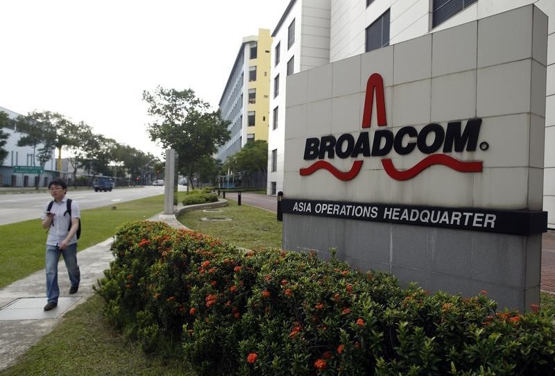 © Reuters. Man passes Broadcom's Asia operations headquarters office at an industrial park in Singapore