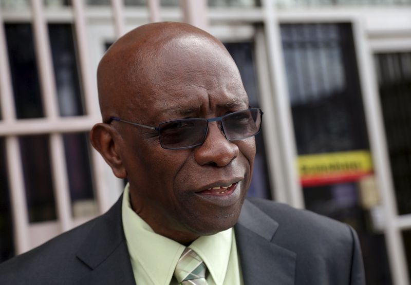 © Reuters. Trinidad and Tobago's former National Security Minister and former FIFA Vice President, Jack Warner, leaves the offices of the Sunshine Newspaper which he owns, in Arouca
