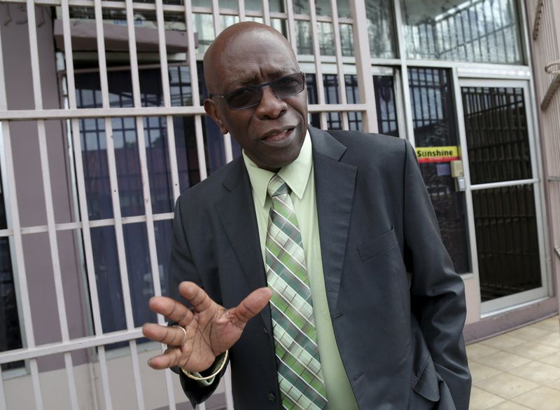 © Reuters. Trinidad and Tobago's former National Security Minister and former FIFA Vice President, Jack Warner, gestures after leaving the offices of the Sunshine Newspaper which he owns, in Arouca, East Trinidad