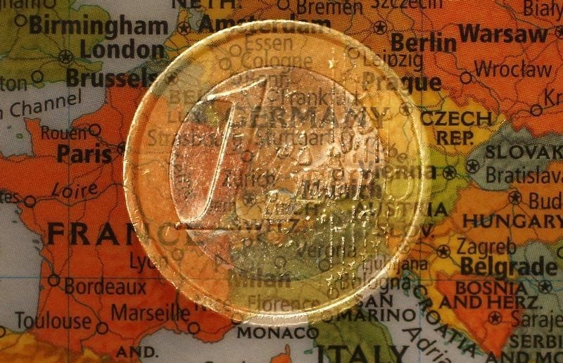 © Reuters. A picture illustration taken with the multiple exposure function of the camera shows a one Euro coin and a map of Europe