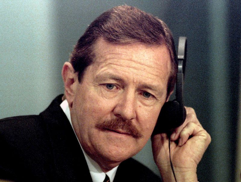 © Reuters. File photo of Clive Derby-Lewis listening to questions during the Truth and Reconcilliation Commission hearing at Pretoria City Hall