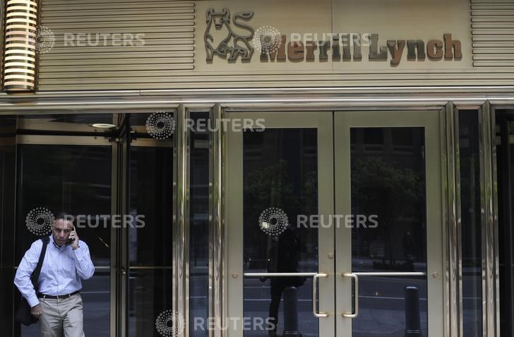 © Reuters. A man speaks on his mobile while standing in front of the Merrill Lynch building in New York