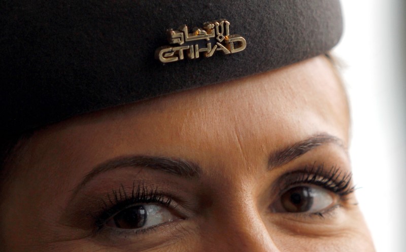 © Reuters. Etihad flight attendant is seen during a news conference at Malpensa Airport  near Milan