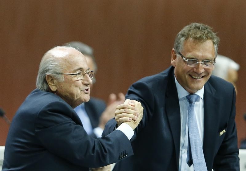 © Reuters. FIFA President Blatter and Valcke, Secretary General of the FIFA do a Handshake For Peace at the 65th FIFA Congress in Zurich