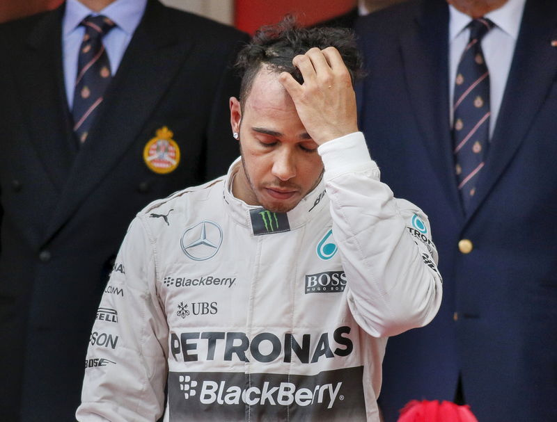 © Reuters. Mercedes Formula One driver Hamilton of Britain reacts on the podium after placing third in the Monaco Grand Prix in Monaco