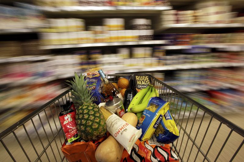 © Reuters. A shopping trolley is pushed around a supermarket in London