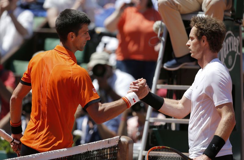 © Reuters. Novak Djokovic of Serbia shakes hands with Andy Murray of Britain after winning their men's semi-final match at the French Open tennis tournament at the Roland Garros stadium in Paris