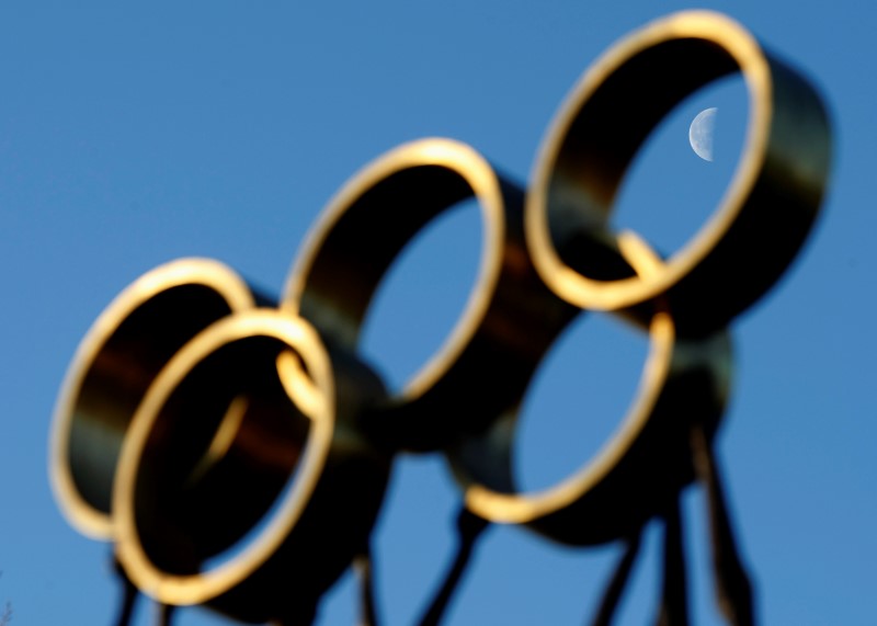 © Reuters. The moon is pictured through a sculpture in front of the IOC headquarters in Lausanne