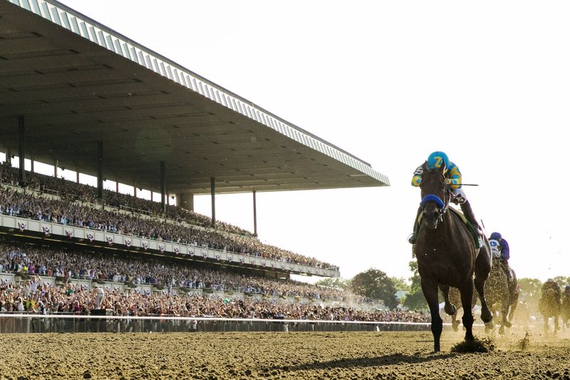 © Reuters. Espinoza, aboard American Pharoah, crosses the finish line as he wins the 147th running of the Belmont Stakes as well as the Triple Crown, in Elmont