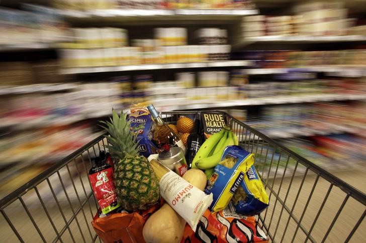 © Reuters. A shopping trolley is pushed around a supermarket in London