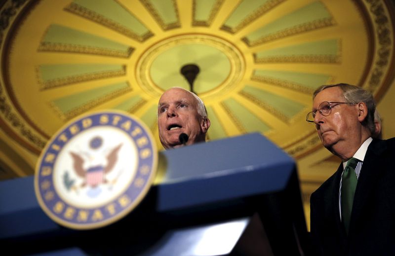 © Reuters. Senator John McCain ( R) (R-AZ) talks to reporters next to U.S. Senate Majority Leader Mitch McConnell (R-KY) during a news conference following party policy lunch meeting at the U.S. Capitol in Washington