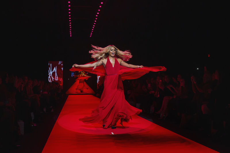 © Reuters. Actress Laverne Cox walks in a Donna Karan creation during a presentation of the Go Red for Women Red Dress collection during New York Fashion Week