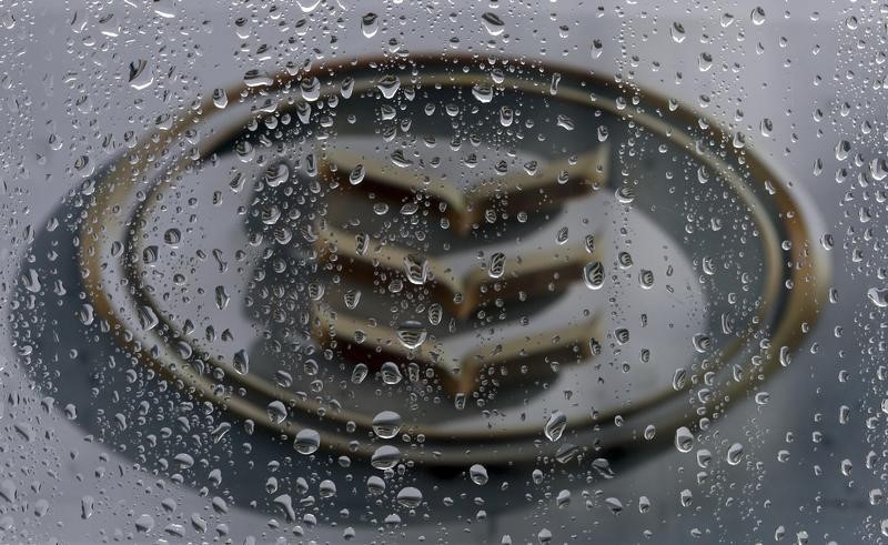 © Reuters. The Bank of Ireland logo is seen through raindrops on a window in Dublin