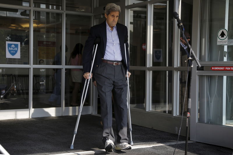 © Reuters. United States Secretary of State John Kerry walks out of Massachusetts General Hospital to speak to reporters in Boston