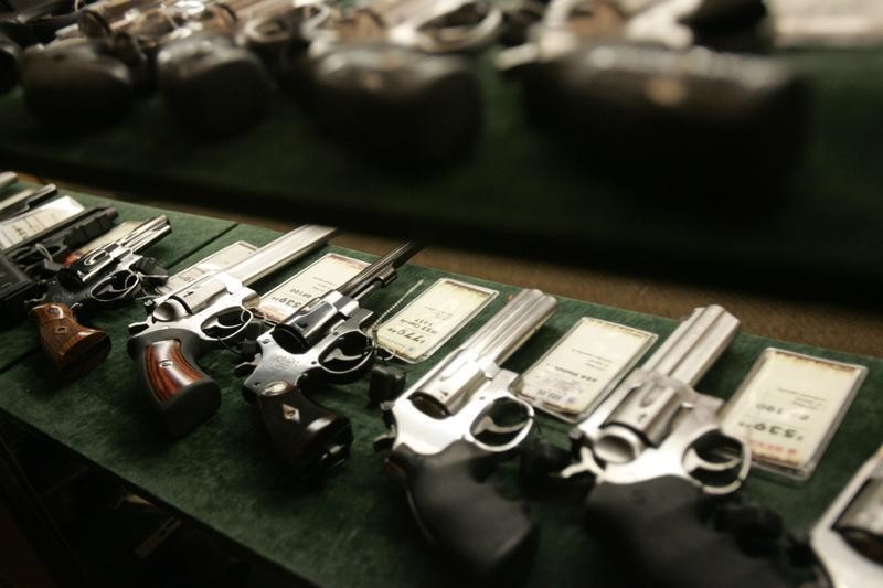 © Reuters. Guns are seen inside a display case at the Cabela's store in Fort Worth