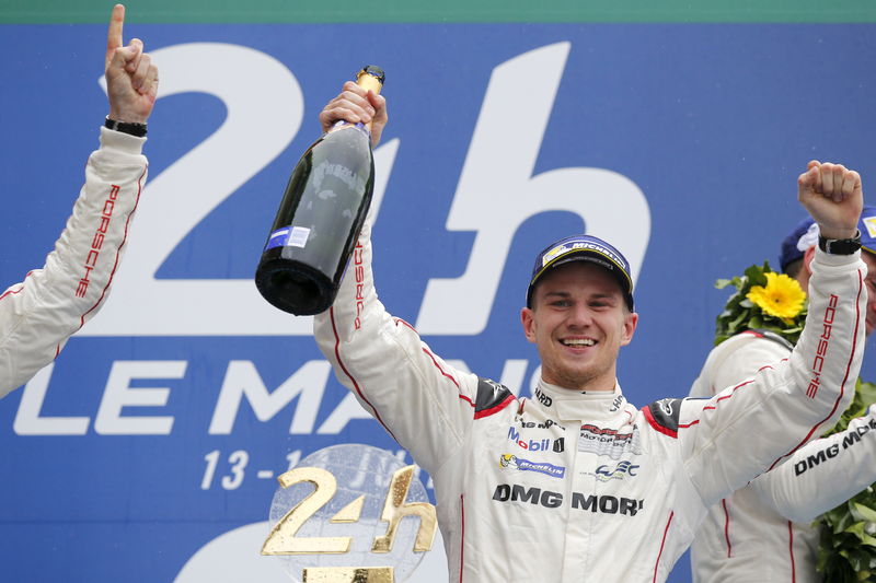 © Reuters. Porsche 919 Hybrid number 19 driver Hulkenberg of Germany celebrates on the podium after winning the Le Mans 24-hour sportscar race in Le Mans, central France