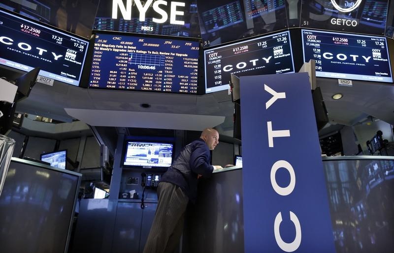 © Reuters. A trader works at the trading post that trades Coty Inc. on the floor of the New York Stock Exchange