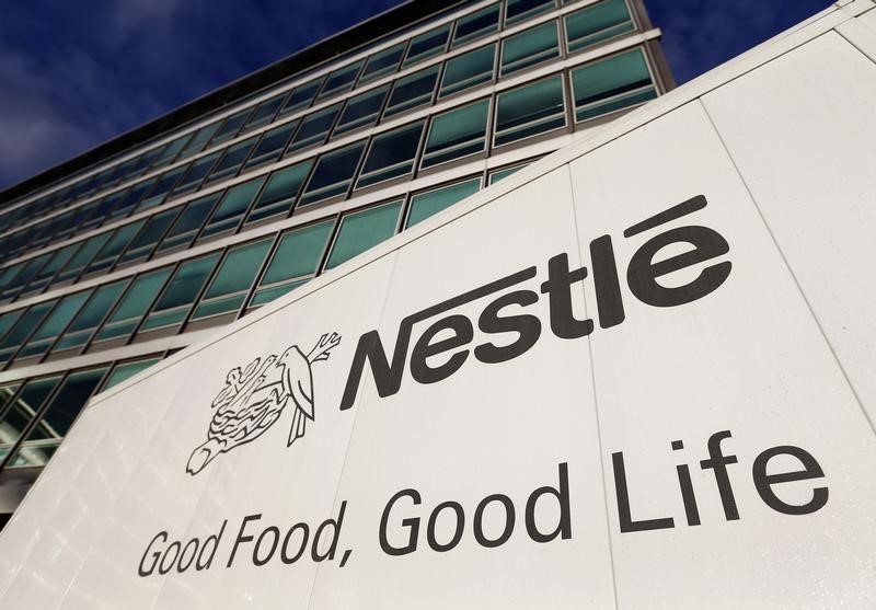 © Reuters. The Nestle logo is pictured on a truck outside the company's headquarters before the nine-month sale figures news conference in Vevey