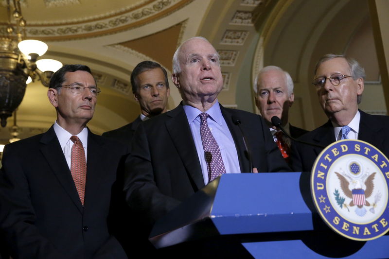 © Reuters. McCain joins McConnell to make comments on military authorization legislation to reporters at the U.S. Capitol in Washington