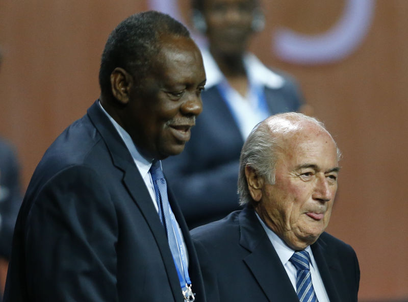 © Reuters. Hayatou, Senior Vice President of the FIFA stands with FIFA President Blatter after he was re-elected at the 65th FIFA Congress in Zurich