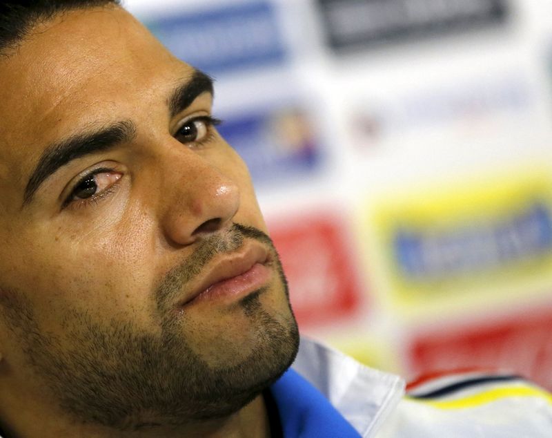 © Reuters. Colombia's captain Radamel Falcao Garcia listens to questions during a news conference before a training session in Santiago