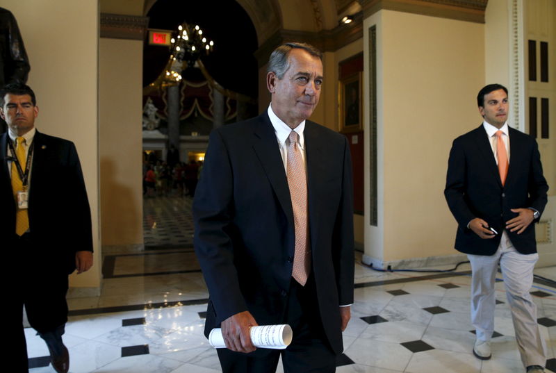 © Reuters. Speaker of the House John Boehner walks to the House Chamber where members of congress were voting on a package of trade bills in the U.S. Capitol in Washington