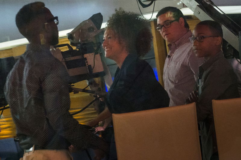 © Reuters. Washington state civil rights advocate Rachel Dolezal smiles towards Izaiah Dolezal while her son Franklin stands nearby on NBC's "Today" show in New York 