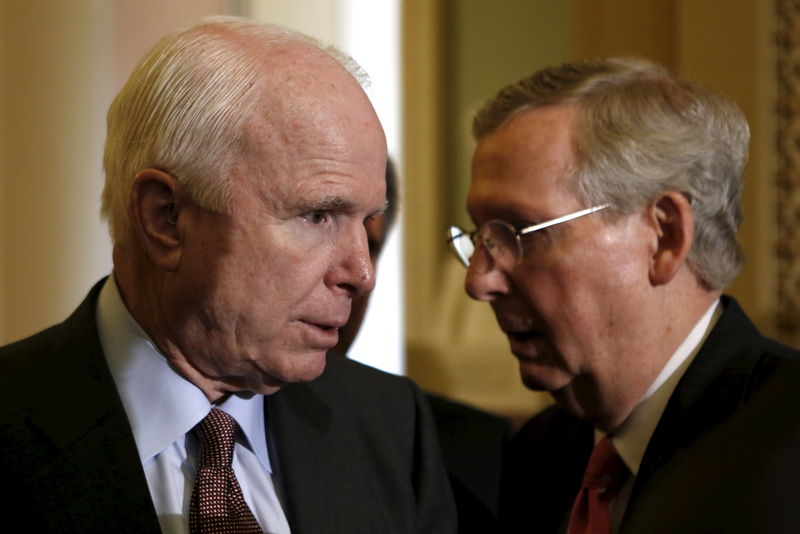 © Reuters. Sen. John McCain (R-AZ) and Senate Majority Leader Mitch McConnell (R-KY) chat after the Senate passed an annual defense policy bill 