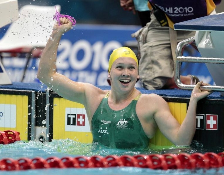 © Reuters. Kylie Palmer of Australia reacts after winning the women's 200m freestyle swimming heats during the Commonwealth Games in New Delhi