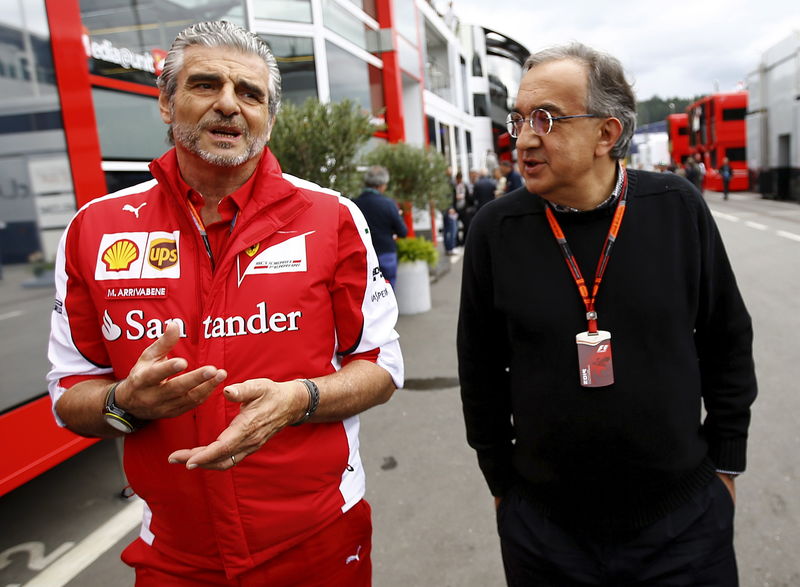 © Reuters. Ferrari Formula One team leader Arrivabene and Marchionne, CEO of Fiat Chrysler automobil arrive in the paddock before the start of the Austrian F1 Grand Prix at the Red Bull Ring circuit in Spielberg