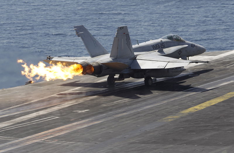 © Reuters. A F/A-18C Hornet of Marine Fighter Attack Squadron 251 (VMFA-251) is catapulted off the flight deck of the USS Theodore Roosevelt (CVN-71) aircraft carrier in the Gulf