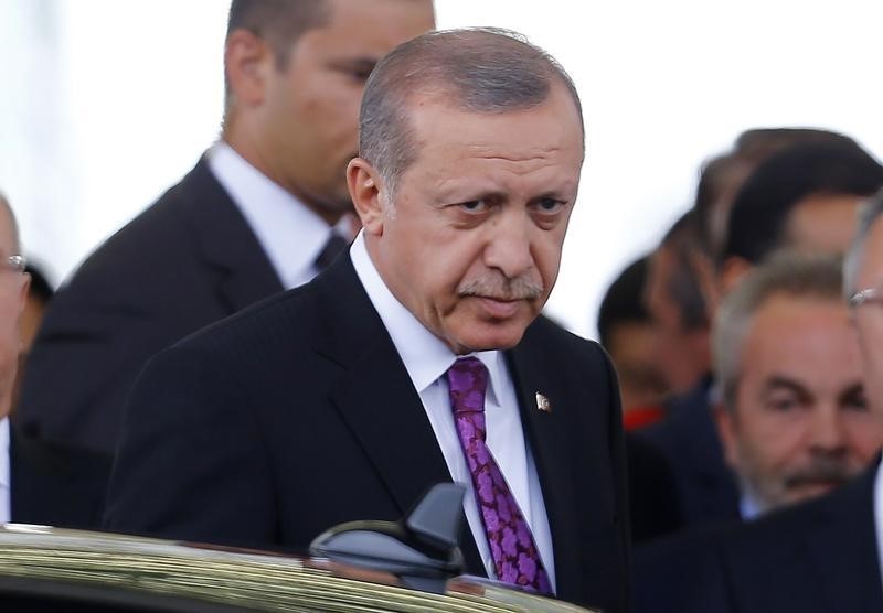 © Reuters. Turkish President Erdogan looks on after arriving at Esenboga Airport in Ankara