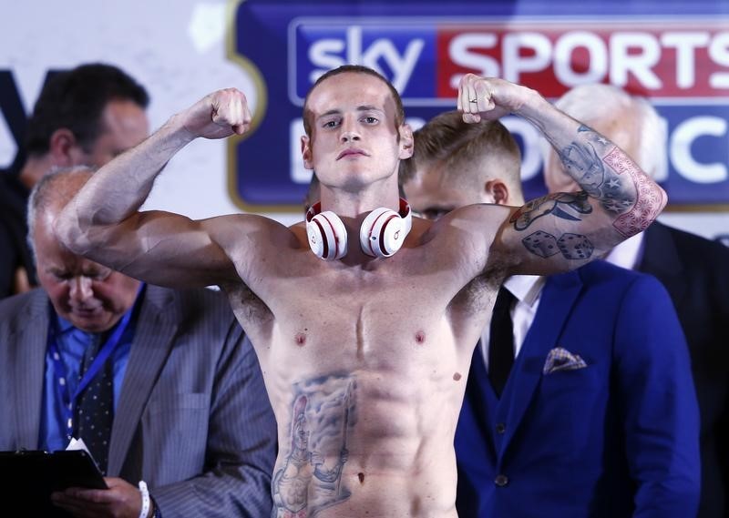 © Reuters. George Groves gestures during the official weigh-in with  Carl Froch at Wembley Arena in London