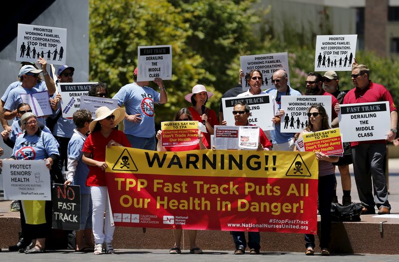 © Reuters. Nurses rally against the fast tracking authority of the Trans-Pacific Partnership trade agreement in San Diego