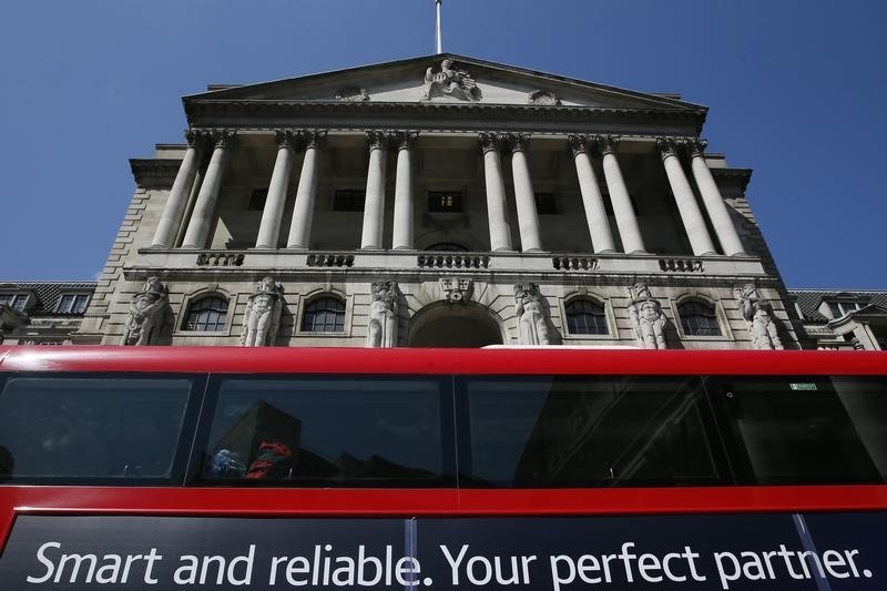 © Reuters. A bus passes the Bank of England in London