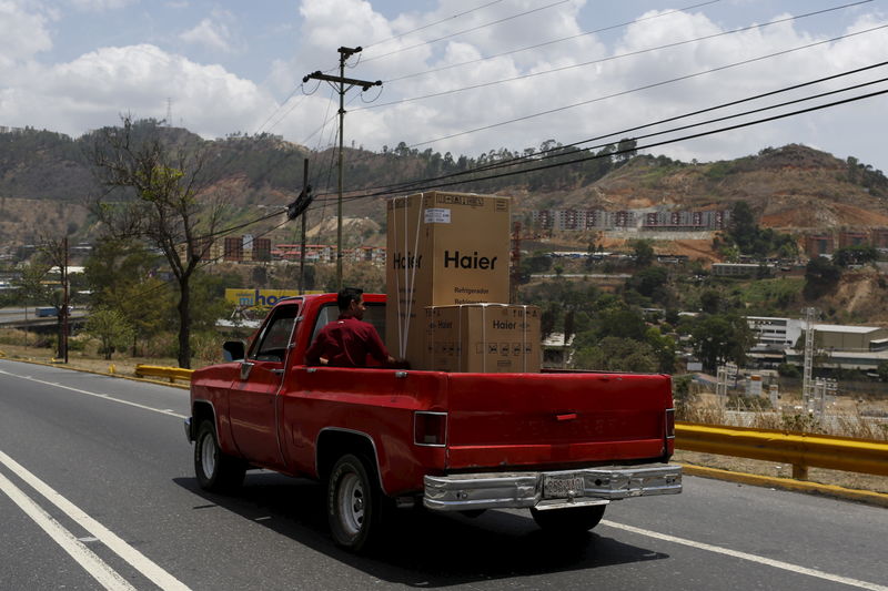 © Reuters. A truck loaded with Haier products is seen on a highway in Caracas