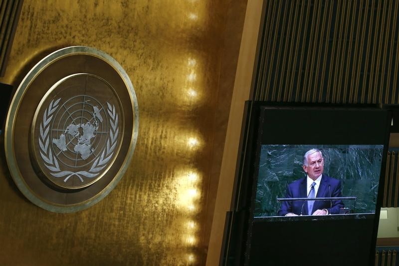 © Reuters. Israel's Prime Minister Benjamin Netanyahu is seen on a video monitor while addressing the 69th United Nations General Assembly in New York