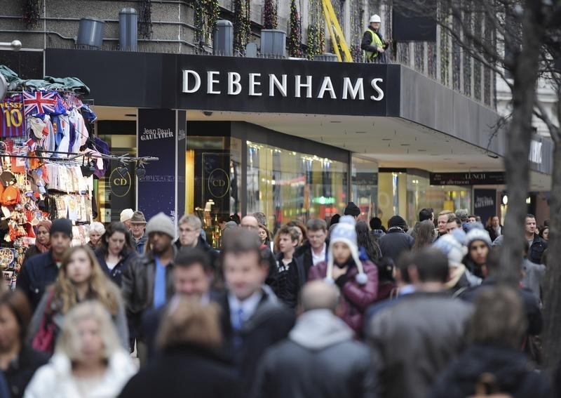© Reuters. People walk past Debenhams department store on Oxford Street, in central London