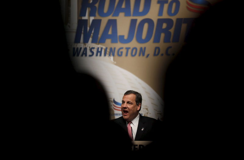 © Reuters. New Jersey Governor Chris Christie, potential Republican presidential candidate, is seen reflected in a teleprompter as he addresses a legislative luncheon held as part of the "Road to Majority" conference in Washington