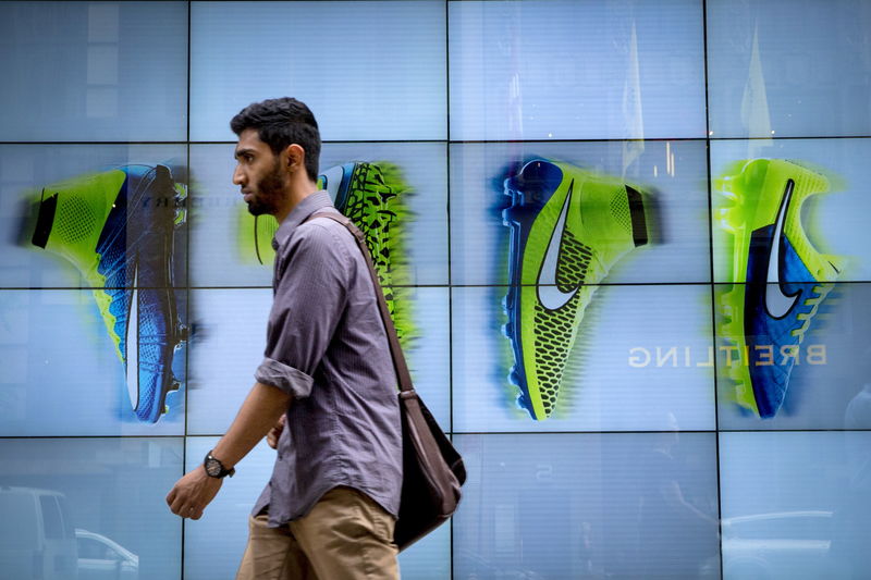 © Reuters. A man passes by the Niketown store in midtown Manhattan in New York 