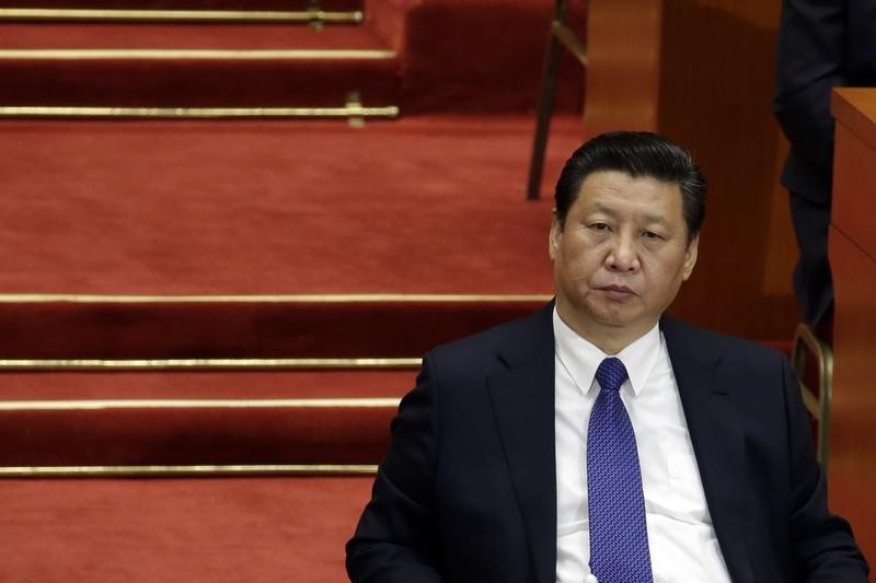 © Reuters. China's President Xi Jinping sits during the opening session of the CPPCC at the Great Hall of the People in Beijing