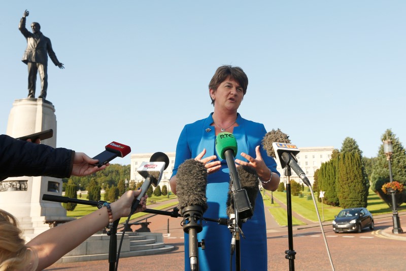 © Reuters. Arlene Foster of the Democratic Unionist Party speaks to the media as she arrives at parliament buildings on the Stormont estate, in Belfast