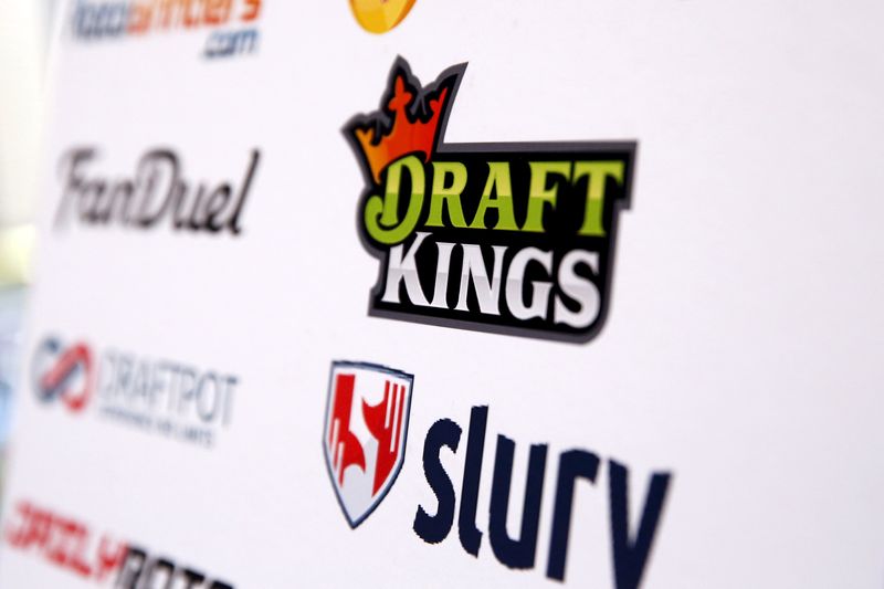 © Reuters. A DraftKings logo is displayed on a board inside of the DFS Players Conference in New York 