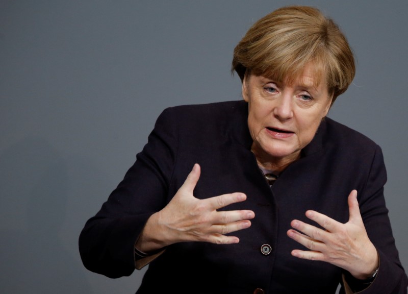 © Reuters. German Chancellor Merkel addresses a session of the German lower house of parliament, the Bundestag, in Berlin