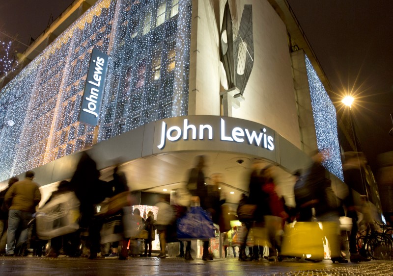 © Reuters. Pedestrians walk past a John Lewis store on Oxford Street in central London