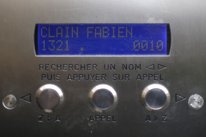 © Reuters. A name reading "Clain Fabien" is seen on the interphone at the entrance of an apartment building where Fabien Clain grew up in Alencon