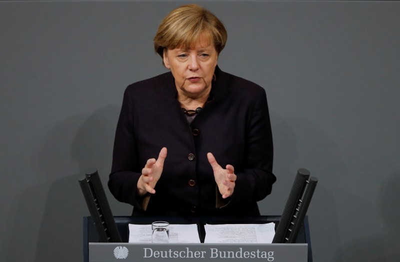 © Reuters. German Chancellor Merkel addresses a session of the German lower house of parliament, the Bundestag, in Berlin