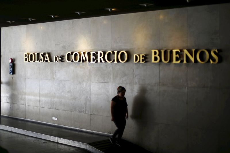 © Reuters. A woman walks at the Buenos Aires stock exchange building